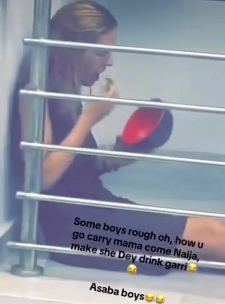 Mixed reactions trail video of Caucasian lady drinking garri on balcony