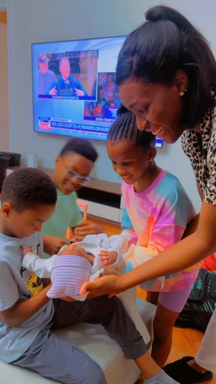 Anita Okoya hailed as Paul introduces their children to Ivy's newborn baby